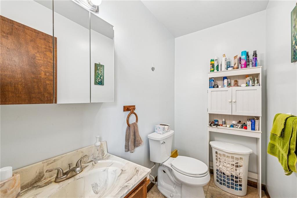 126 Wetzel Road Smock, PA 15480 - Photo 20 of 33 a bathroom with a sink a toilet and a shower curtain