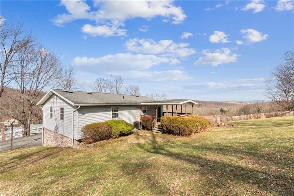 126 Wetzel Road Smock, PA 15480 - Photo 25 of 33 a view of a house with a yard