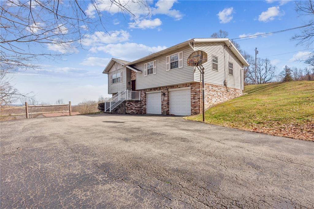 126 Wetzel Road Smock, PA 15480 - Photo 28 of 33 a view of a house with a yard
