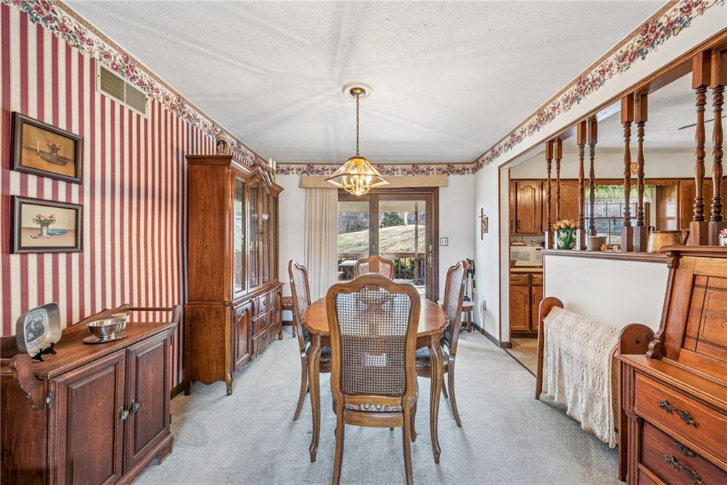 126 Wetzel Road Smock, PA 15480 - Photo 6 of 33 a dining room with furniture window and wooden floor