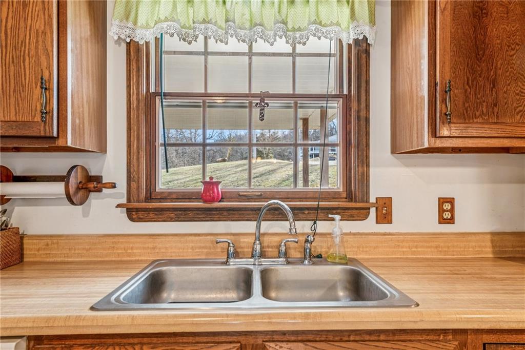 126 Wetzel Road Smock, PA 15480 - Photo 10 of 33 a kitchen sink with a granite countertop window and sink