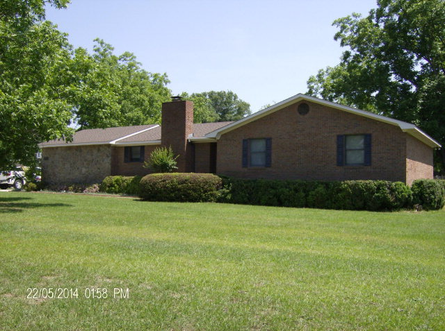 5201 Rogers Road Lizella, GA 31052 - Photo 14 of 19 a front view of a house with a yard