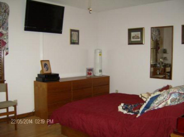 5201 Rogers Road Lizella, GA 31052 - Photo 8 of 19 a bedroom with a bed and a flat screen tv