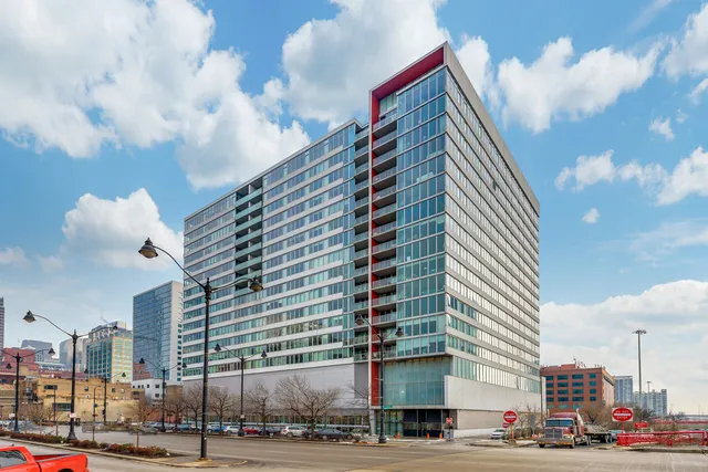a city street lined with buildings and trees