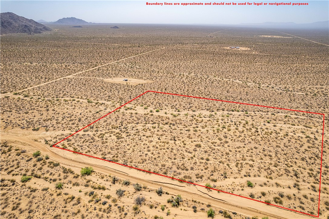 0 East Arroyo Road Yucca, AZ 86438 - Photo 5 of 25 This expansive desert property features natural vegetation and a rugged dirt road