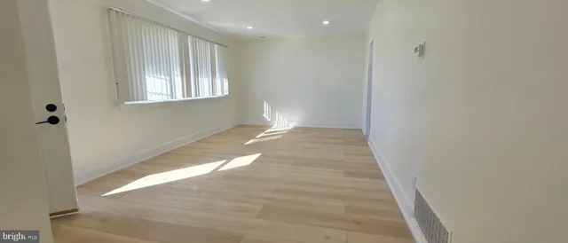 a view of an empty room and window