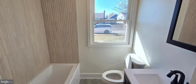 a bathroom with a toilet and a sink