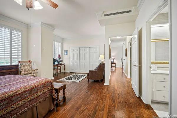 a bathroom with a double vanity sink toilet and shower