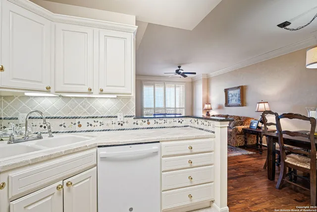 a kitchen with cabinets appliances and a counter space