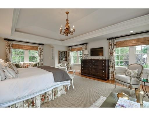23 Bogle Street Weston, MA 02493 - Photo 14 of 23 a spacious bedroom with a bed a couch and dresser