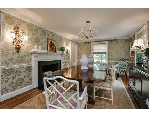 23 Bogle Street Weston, MA 02493 - Photo 4 of 23 a living room with furniture a dining table and a fireplace