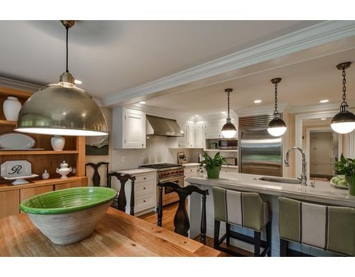 23 Bogle Street Weston, MA 02493 - Photo 6 of 23 a kitchen with stainless steel appliances kitchen island granite countertop a stove a sink and a wooden floors