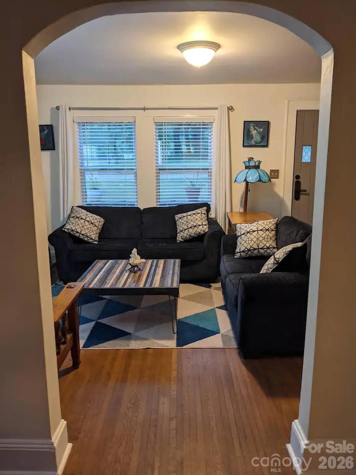 4033 West Tyvola Road Charlotte, NC 28208 - Photo 12 of 48 a living room with furniture and a window
