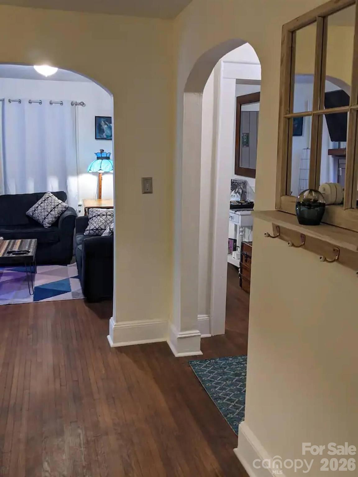 4033 West Tyvola Road Charlotte, NC 28208 - Photo 20 of 48 a living room with furniture and a rug
