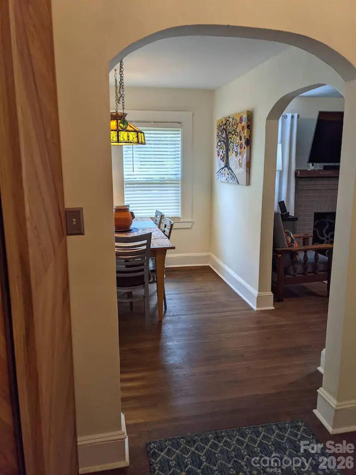 4033 West Tyvola Road Charlotte, NC 28208 - Photo 21 of 48 a view of a livingroom with wooden floor and furniture