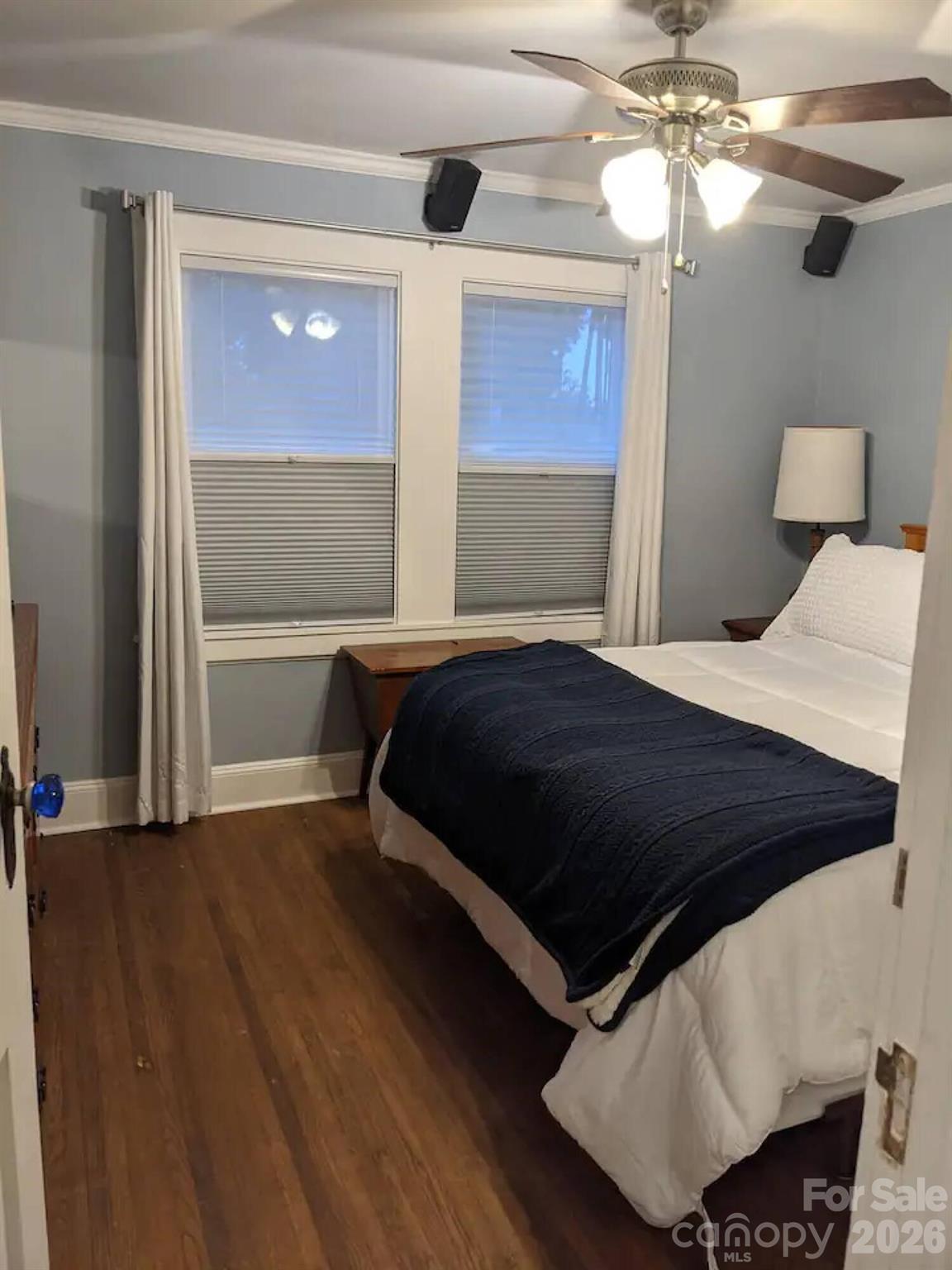 4033 West Tyvola Road Charlotte, NC 28208 - Photo 34 of 48 a bedroom with a bed and a chandelier