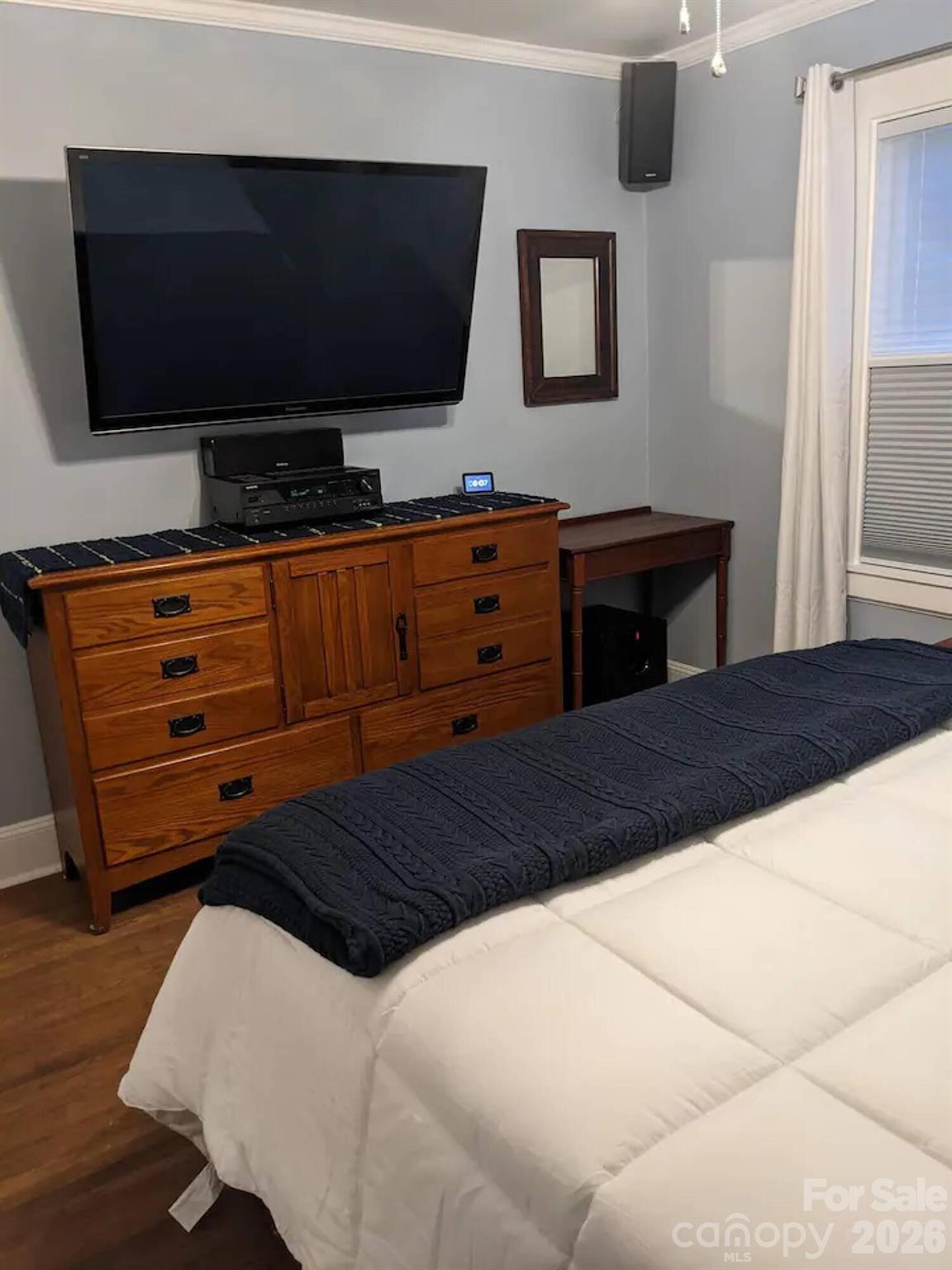 4033 West Tyvola Road Charlotte, NC 28208 - Photo 35 of 48 a bedroom with a bed and a flat screen tv