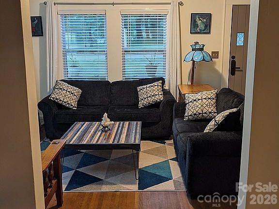 4033 West Tyvola Road Charlotte, NC 28208 - Photo 4 of 48 a living room with furniture and a window