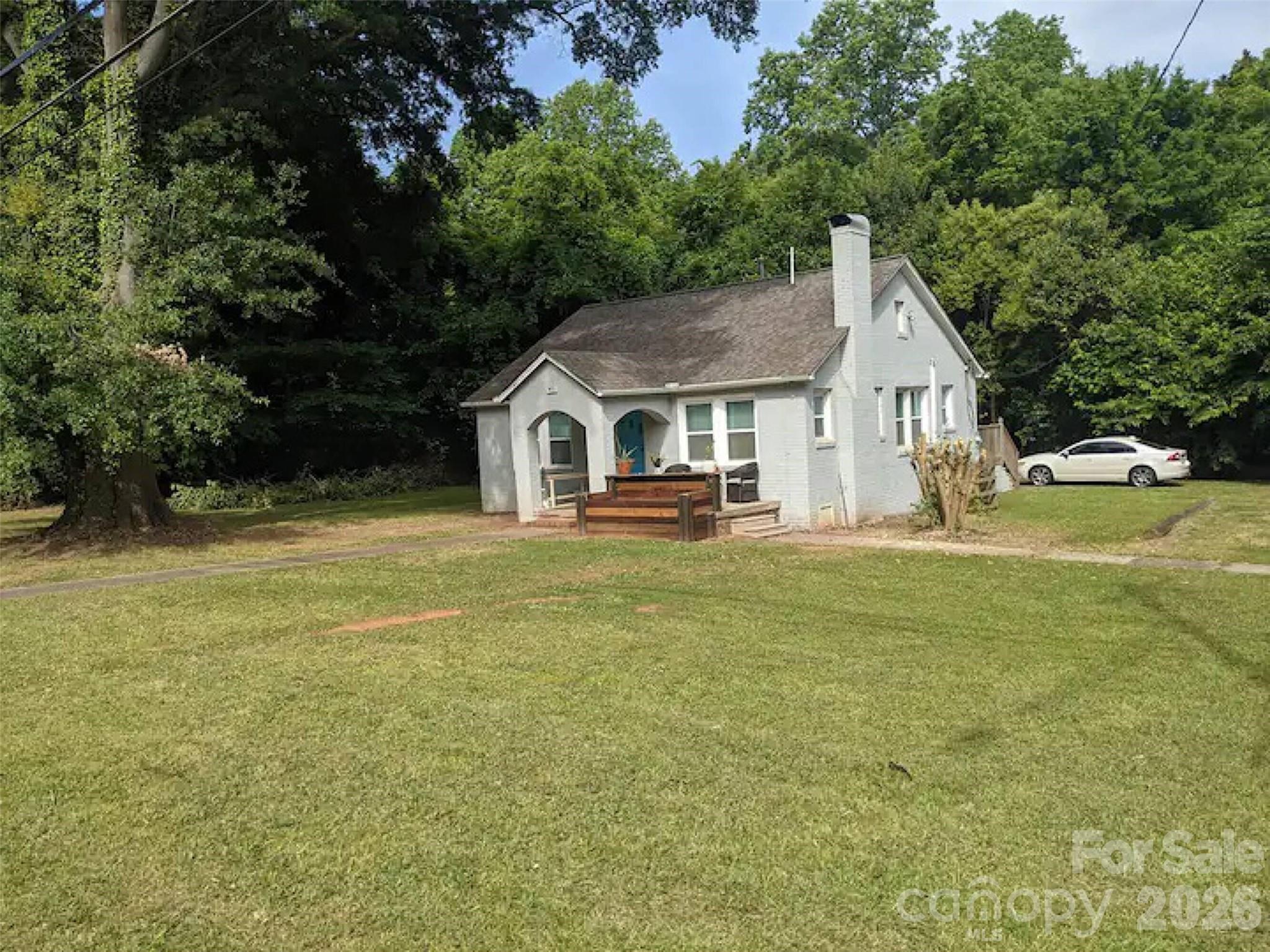4033 West Tyvola Road Charlotte, NC 28208 - Photo 43 of 48 a front view of a house with garden