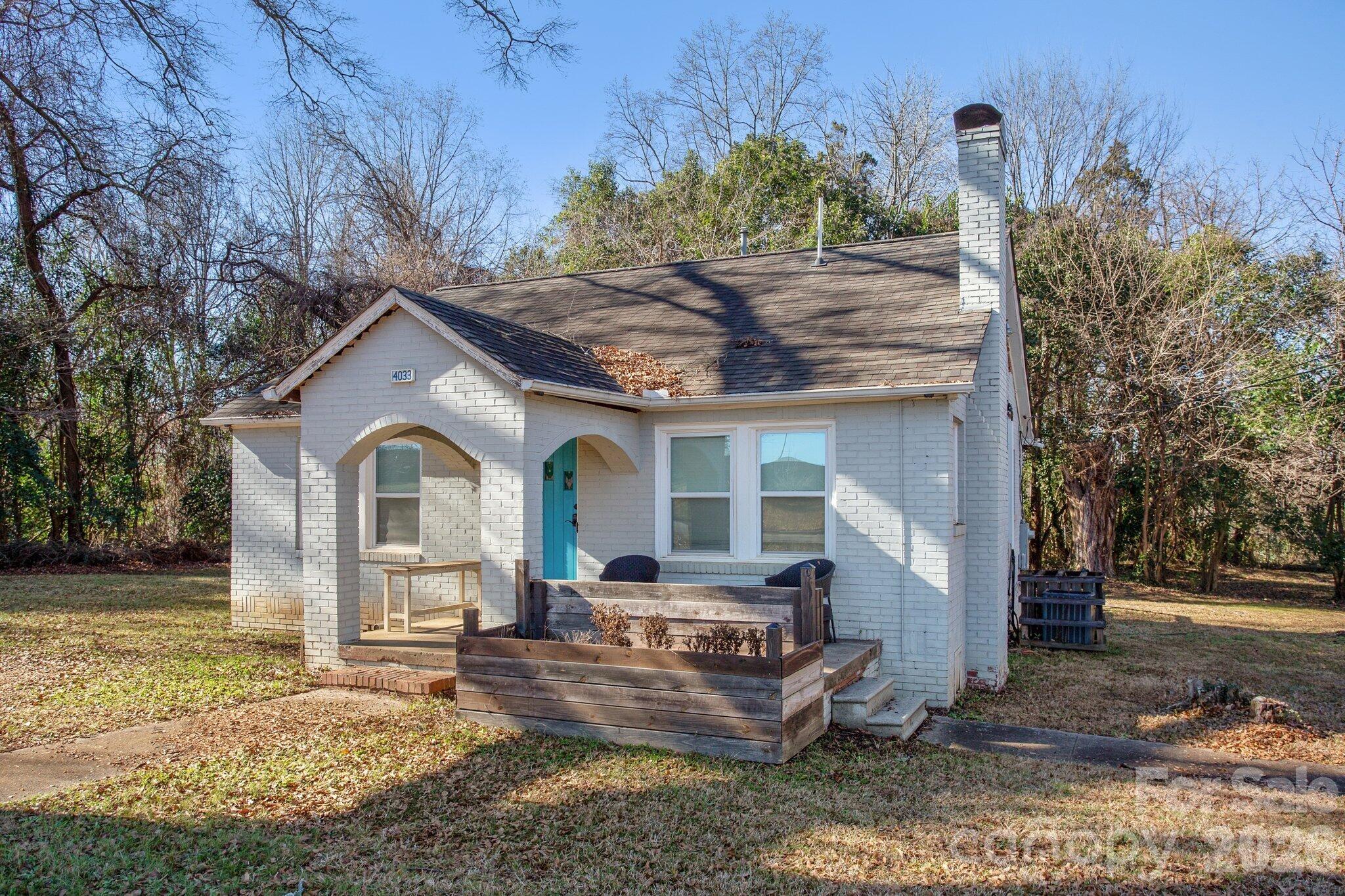 4033 West Tyvola Road Charlotte, NC 28208 - Photo 44 of 48 a front view of a house with garden