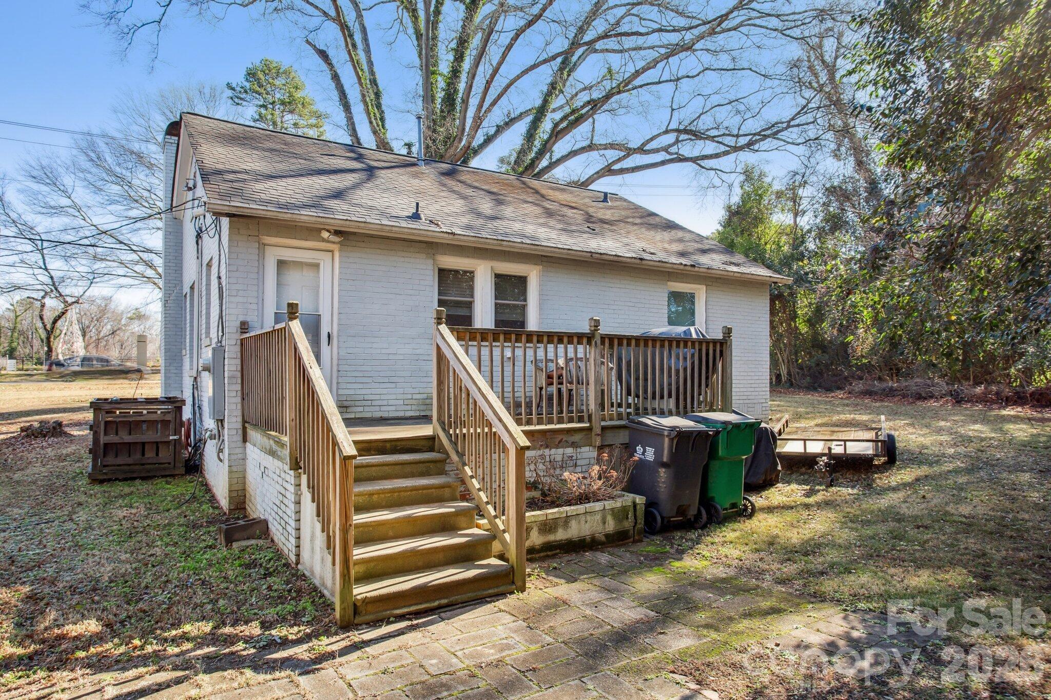 4033 West Tyvola Road Charlotte, NC 28208 - Photo 48 of 48 a view of patio with a table and chairs