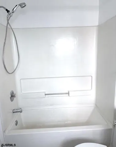 a close view of a bathtub in a bathroom