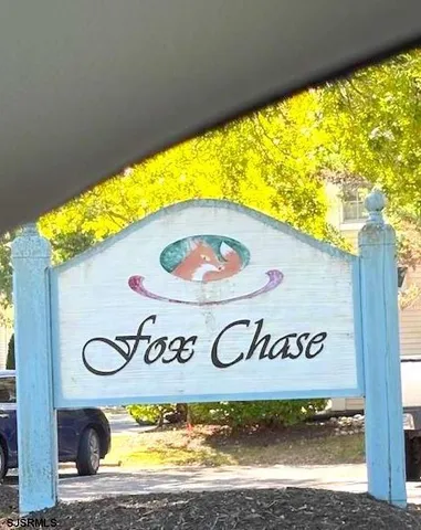 a sign that is on a wall next to a building