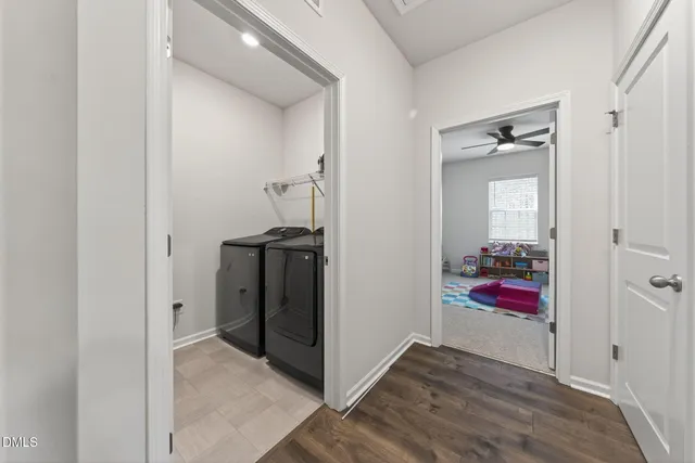 wooden floor with closet and mirror