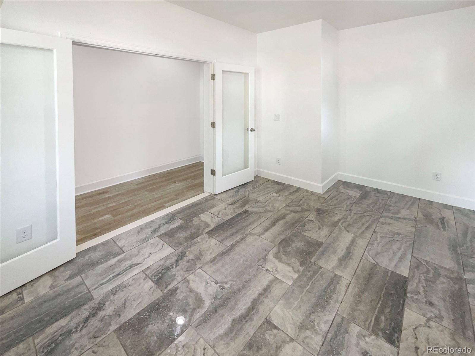 27895 East 7th Place Aurora, CO 80018 - Photo 11 of 35 a view of an empty room