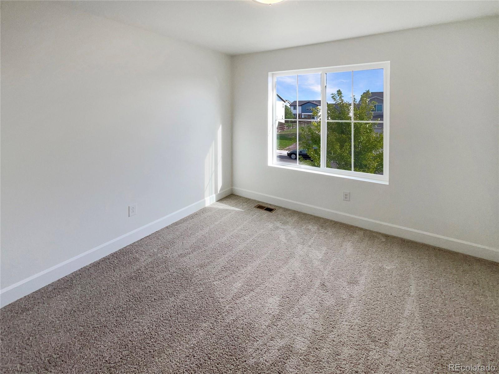 27895 East 7th Place Aurora, CO 80018 - Photo 22 of 35 an empty room with a window