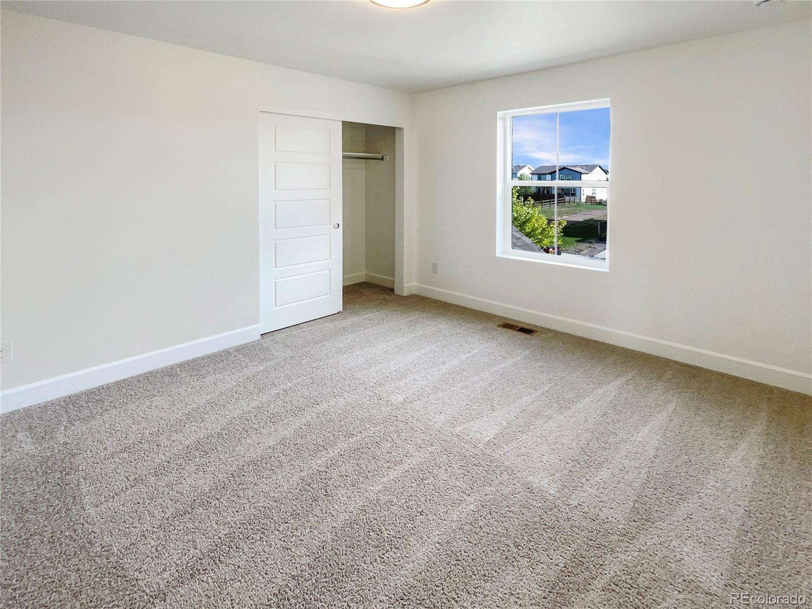 27895 East 7th Place Aurora, CO 80018 - Photo 26 of 35 an empty room with windows