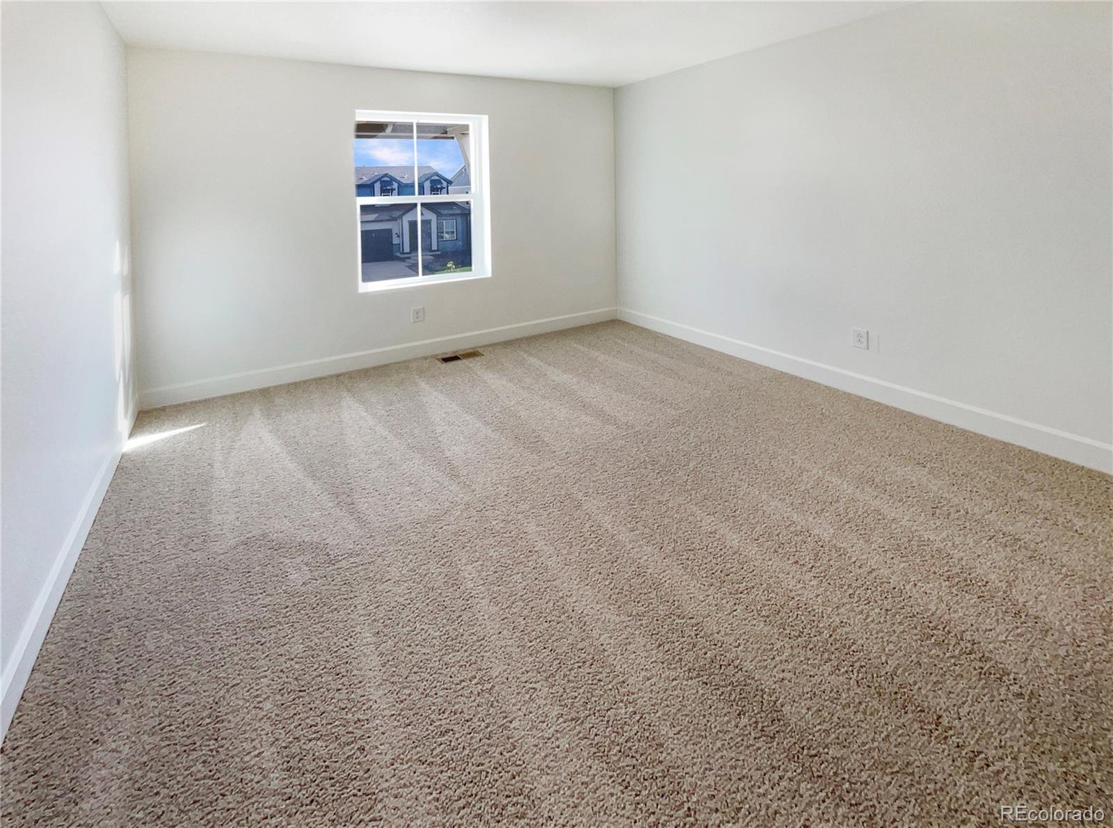 27895 East 7th Place Aurora, CO 80018 - Photo 28 of 35 an empty room with windows