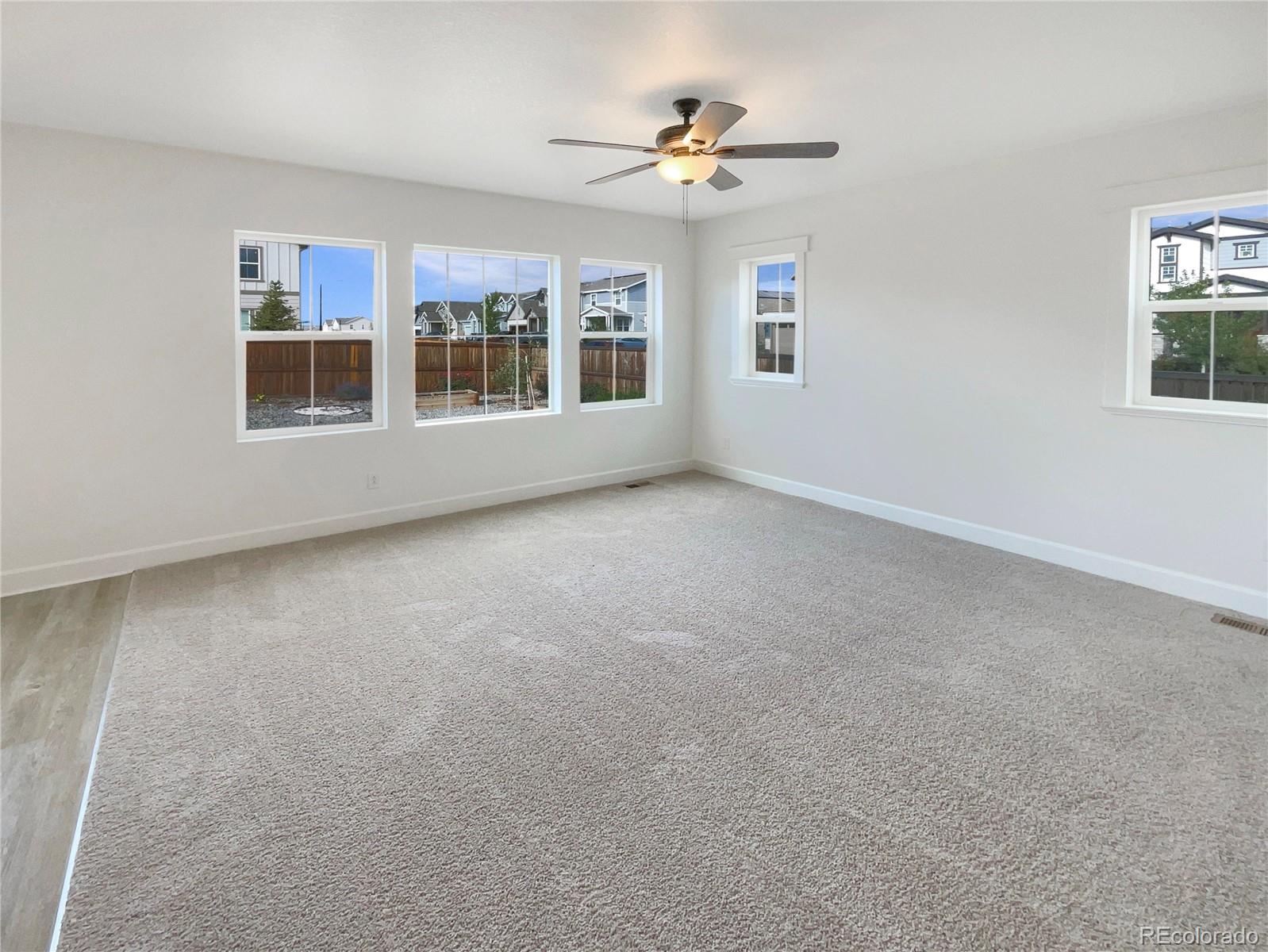 27895 East 7th Place Aurora, CO 80018 - Photo 3 of 35 a view of an empty room with a window