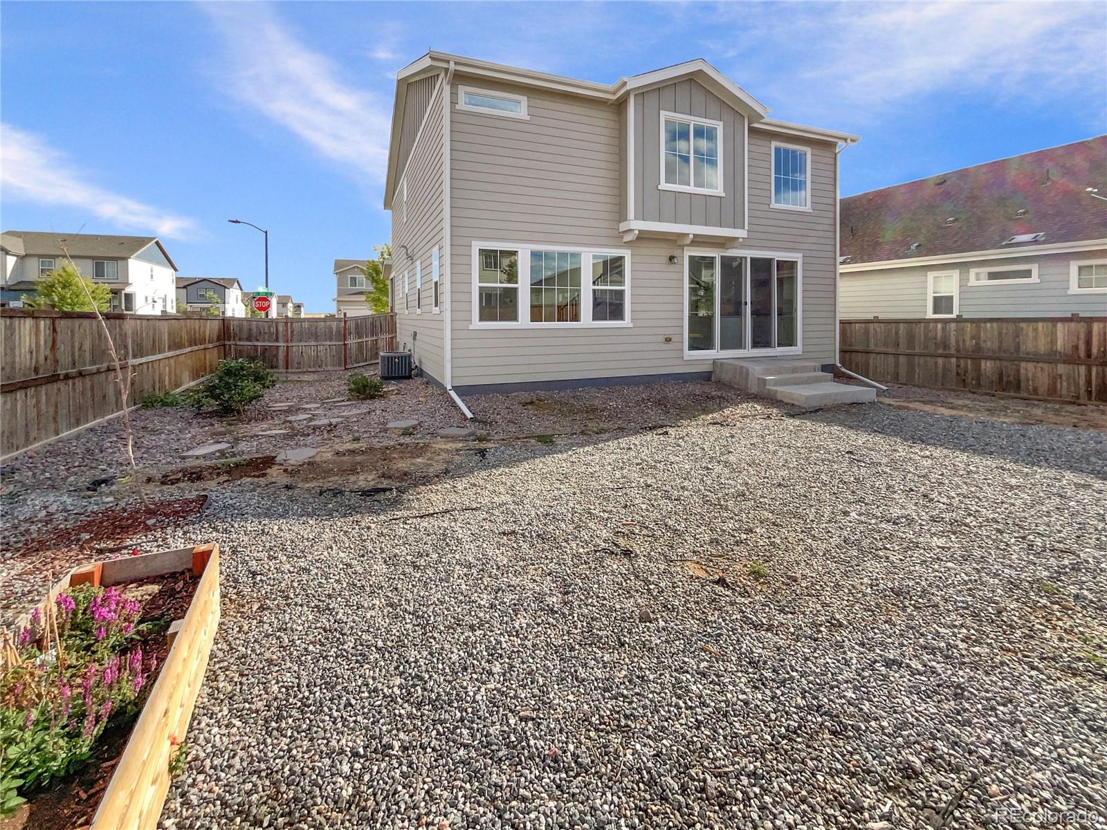 27895 East 7th Place Aurora, CO 80018 - Photo 34 of 35 a view of a house with a patio