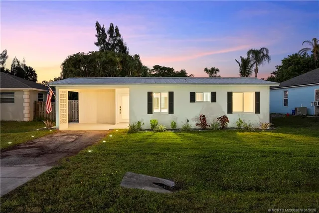 a view of a backyard with a garden and plants