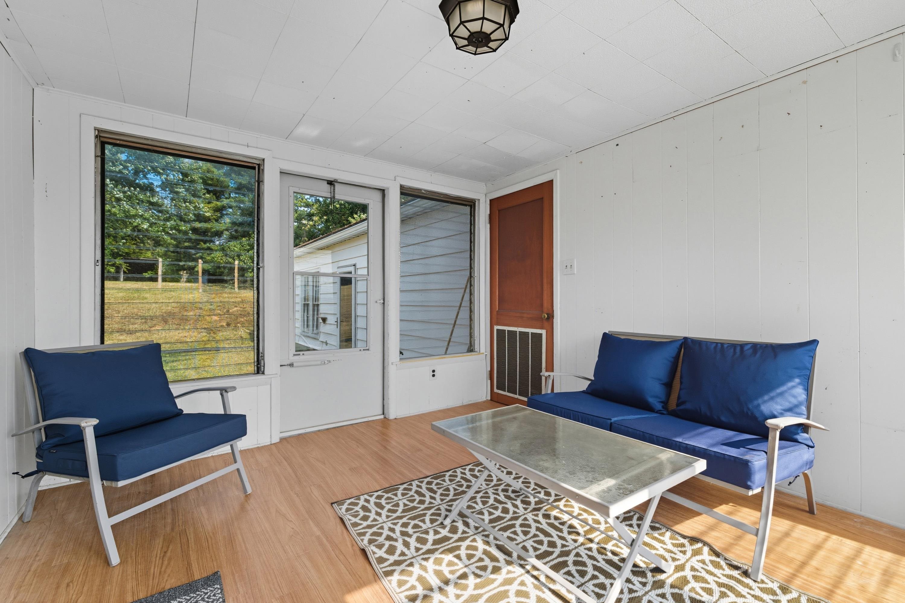 3138 Cross Keys Road Harrisonburg, VA 22801 - Photo 39 of 74 The porch area runs between the garage and main house. This room features lots of space for seating!