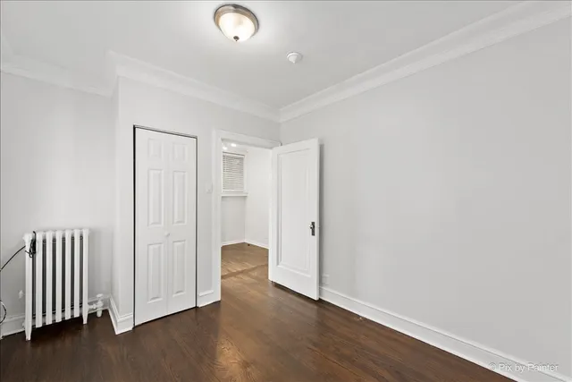 an empty room with wooden floor