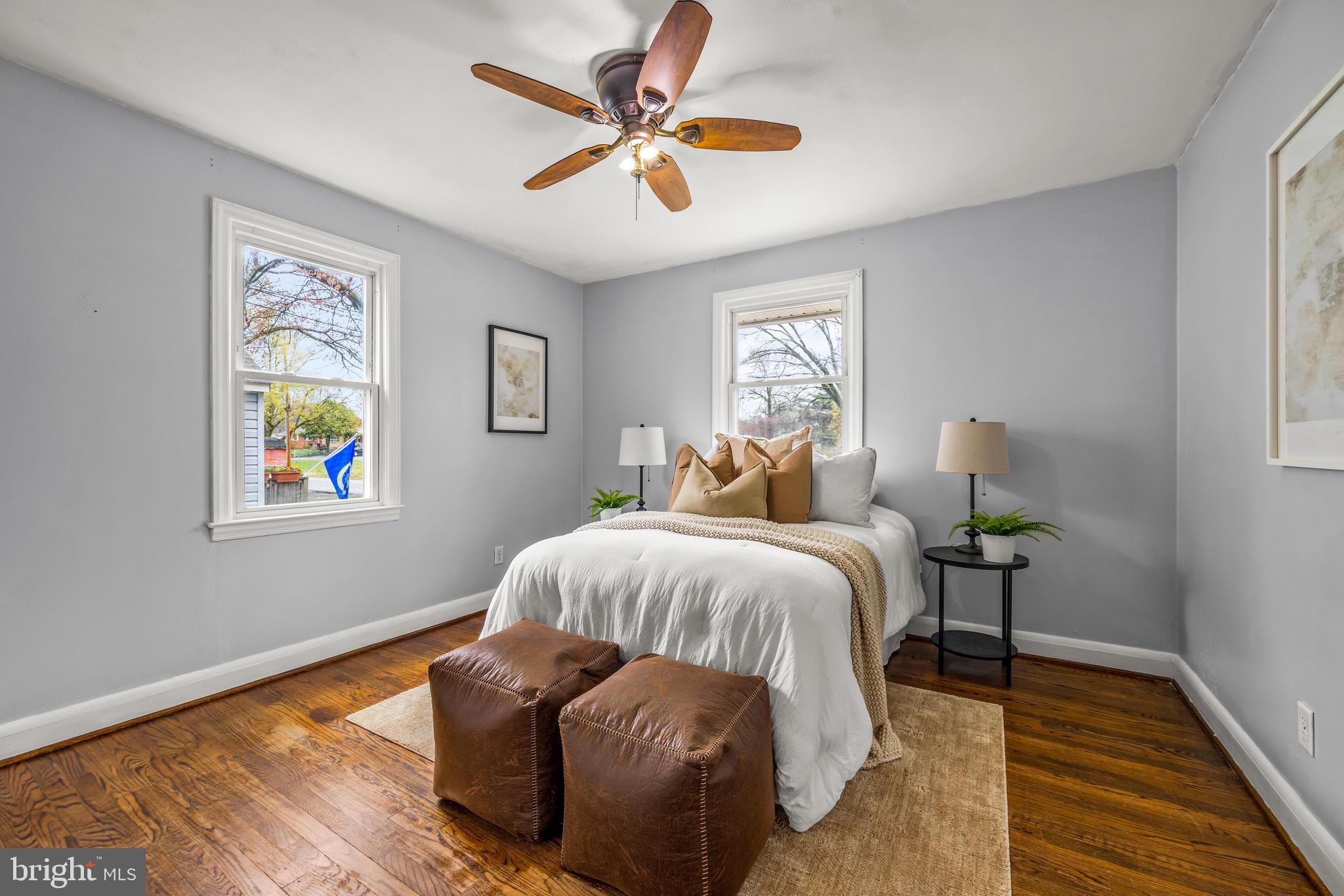 100 Prospect Road Glen Burnie, MD 21060 - Photo 13 of 26 a bedroom with a bed and a chandelier