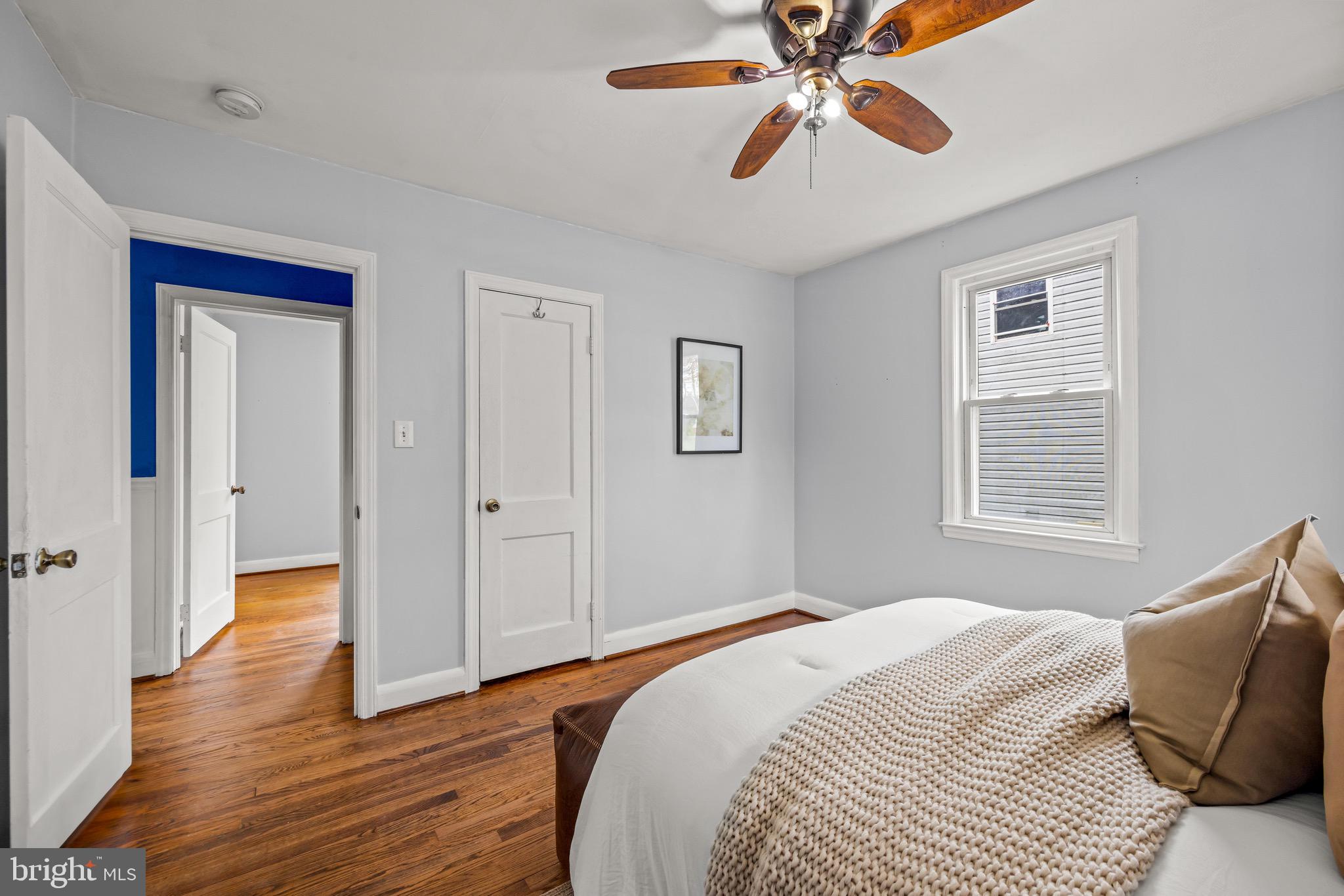 100 Prospect Road Glen Burnie, MD 21060 - Photo 14 of 26 a bedroom with a bed and wooden floor