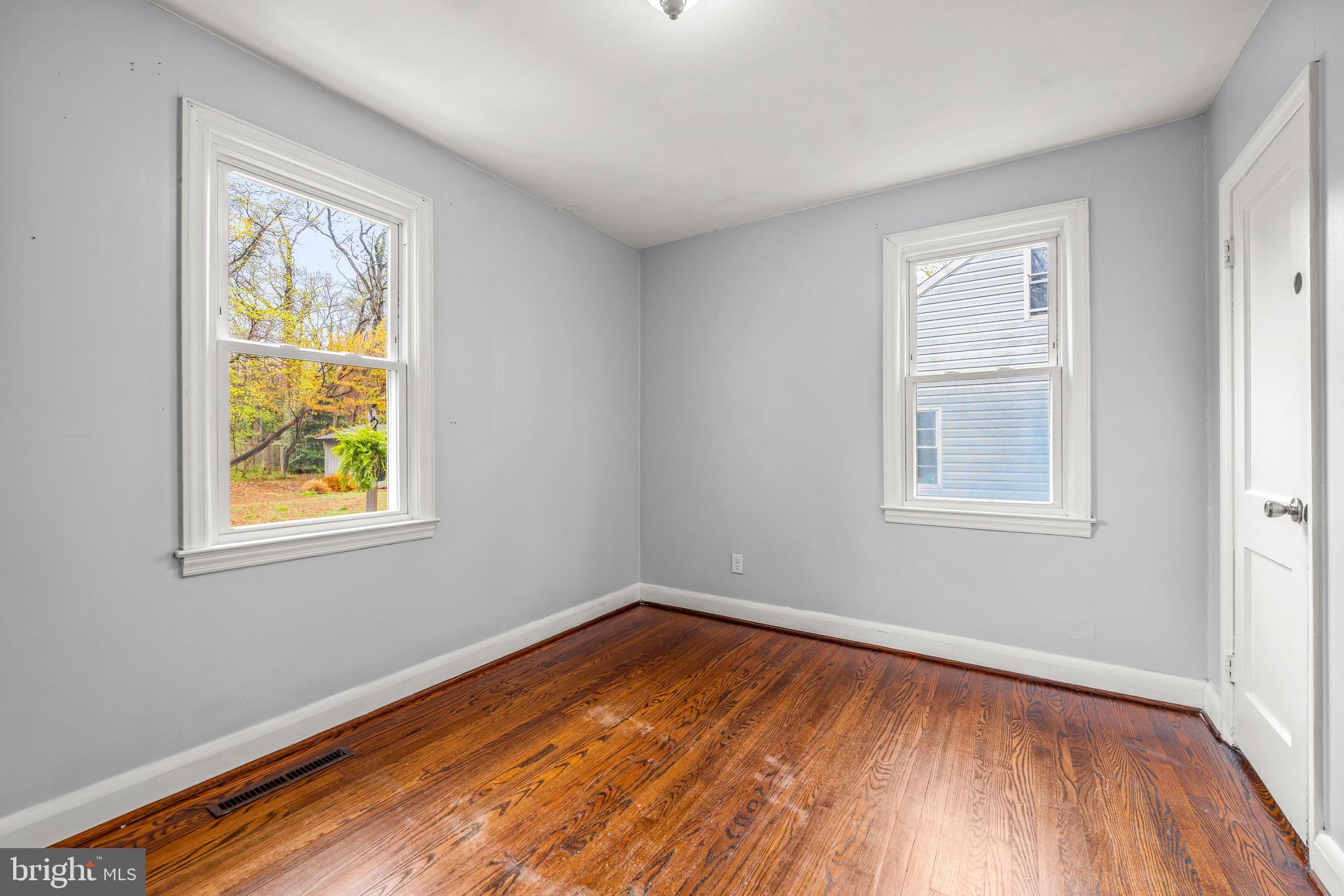 100 Prospect Road Glen Burnie, MD 21060 - Photo 15 of 26 a view of an empty room with wooden floor and a window