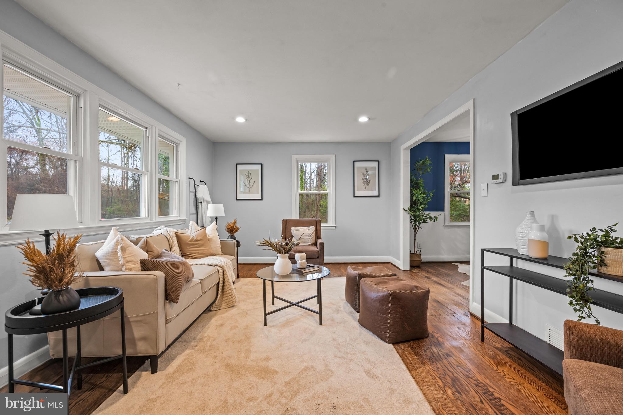 100 Prospect Road Glen Burnie, MD 21060 - Photo 2 of 26 a living room with furniture and a flat screen tv