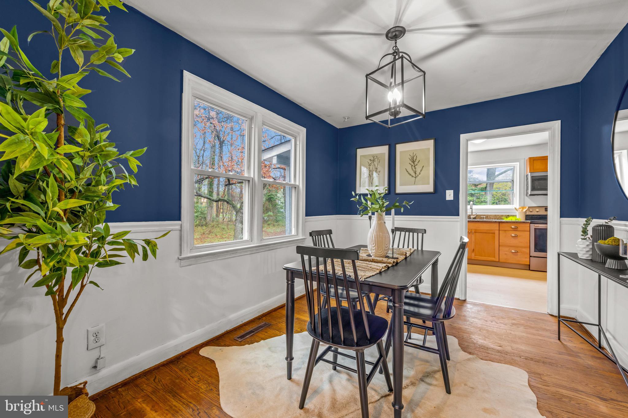 100 Prospect Road Glen Burnie, MD 21060 - Photo 7 of 26 a view of a dining room with furniture window and wooden floor