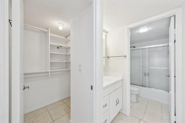 a bathroom with a shower and a sink
