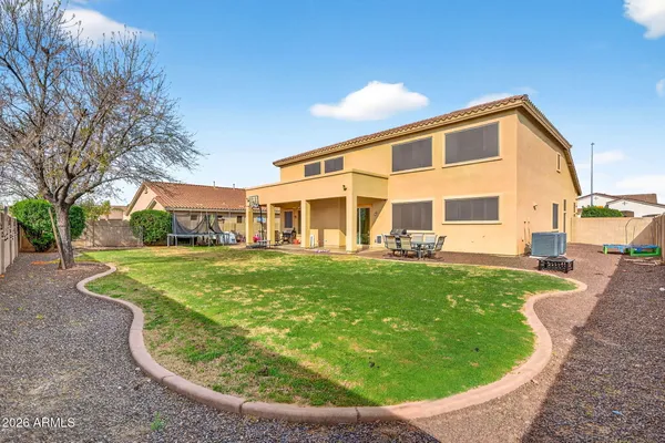 a view of a patio with couches chairs and potted plants