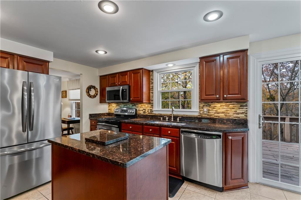 130 Tory Road Coraopolis, PA 15108 - Photo 18 of 50 a kitchen with stainless steel appliances granite countertop a stove a sink dishwasher and a refrigerator