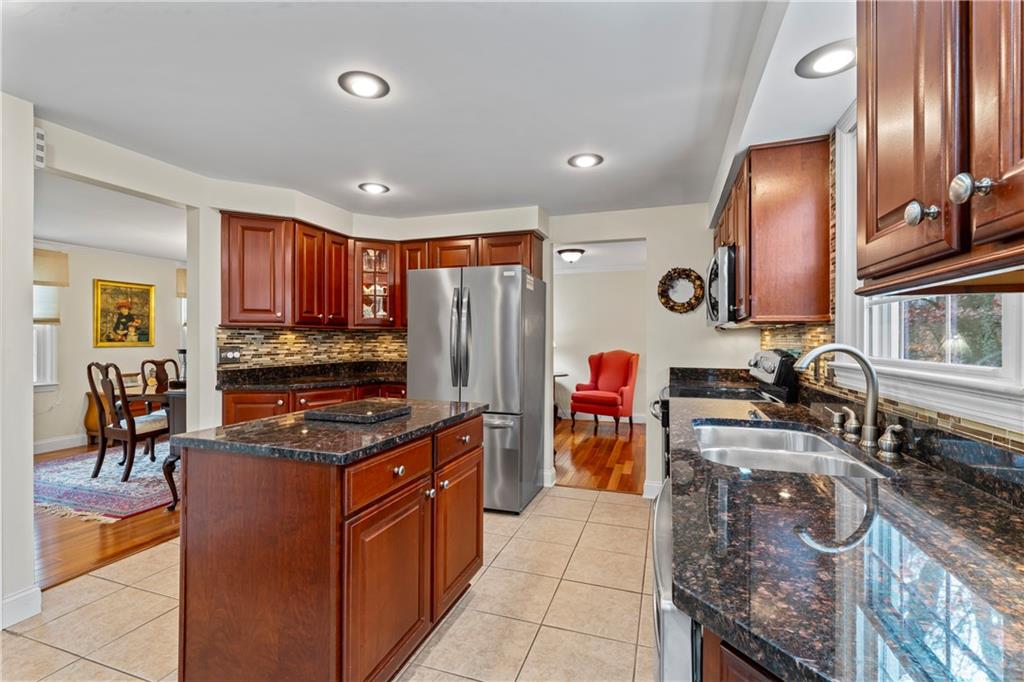130 Tory Road Coraopolis, PA 15108 - Photo 19 of 50 a kitchen with stainless steel appliances granite countertop a sink stove and refrigerator