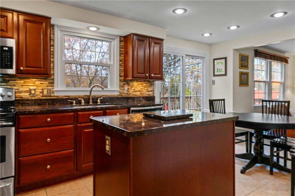 130 Tory Road Coraopolis, PA 15108 - Photo 23 of 50 a kitchen with stainless steel appliances granite countertop a sink stove and cabinets