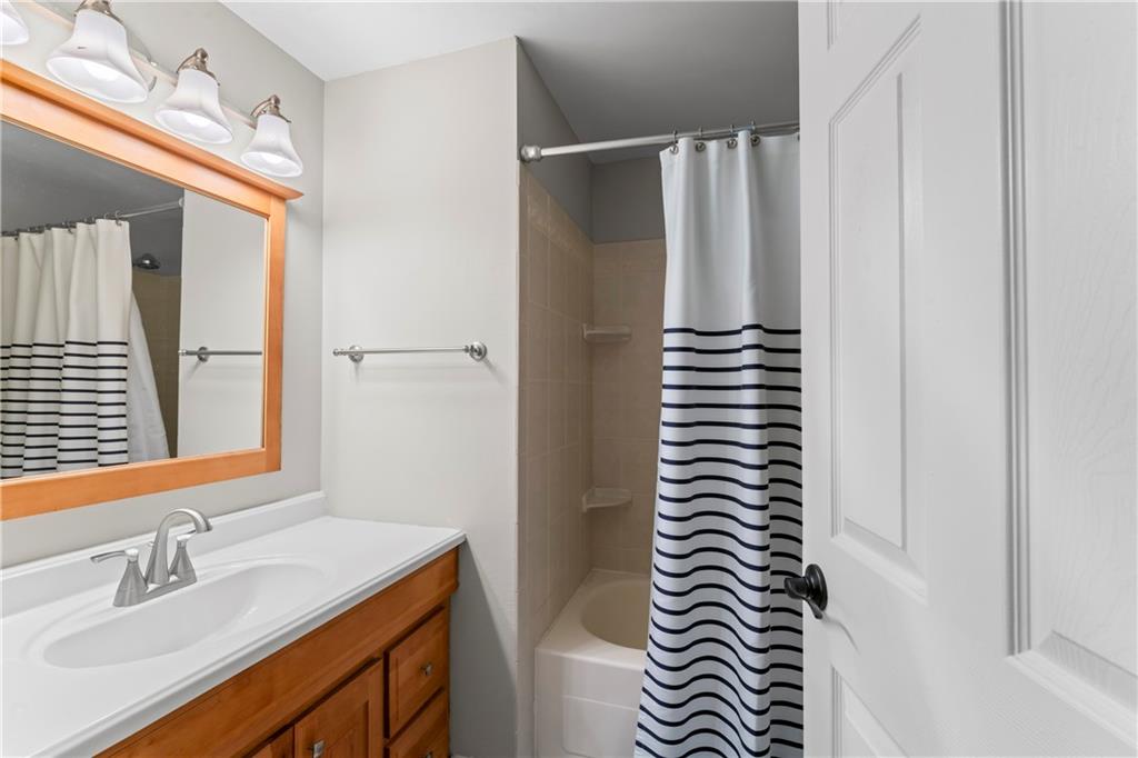 130 Tory Road Coraopolis, PA 15108 - Photo 32 of 50 a bathroom with a sink a mirror and a shower