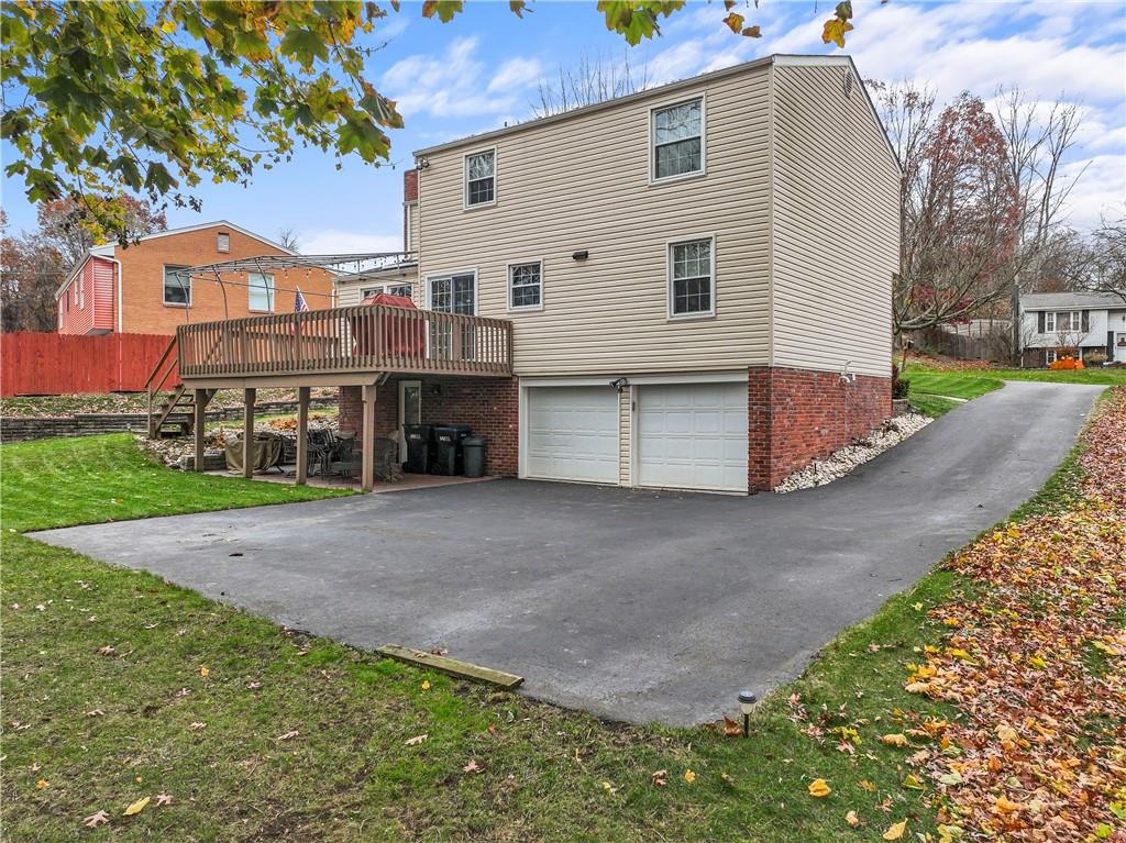 130 Tory Road Coraopolis, PA 15108 - Photo 40 of 50 a view of a house with a yard and a large tree