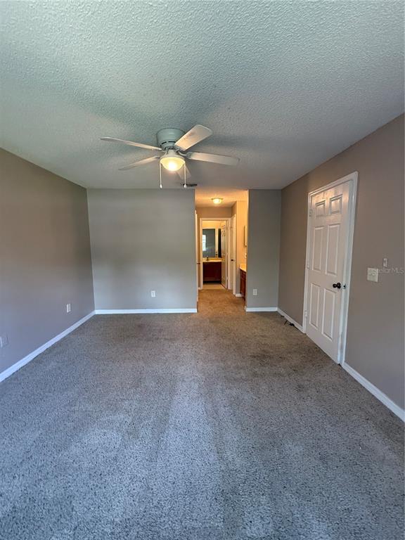 8209 Olympia Court Longwood, FL 32779 - Photo 12 of 29 a view of a room with a ceiling fan and window